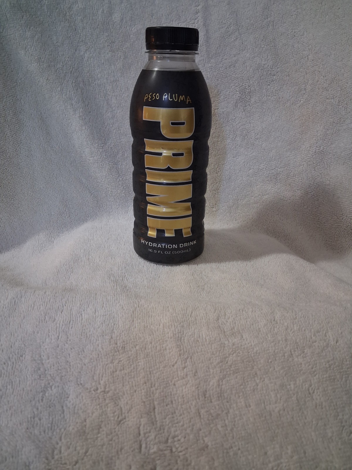 BRAND NEW black Peso Pluma Prime Hydration Drink U.S.A bottle orange and mango